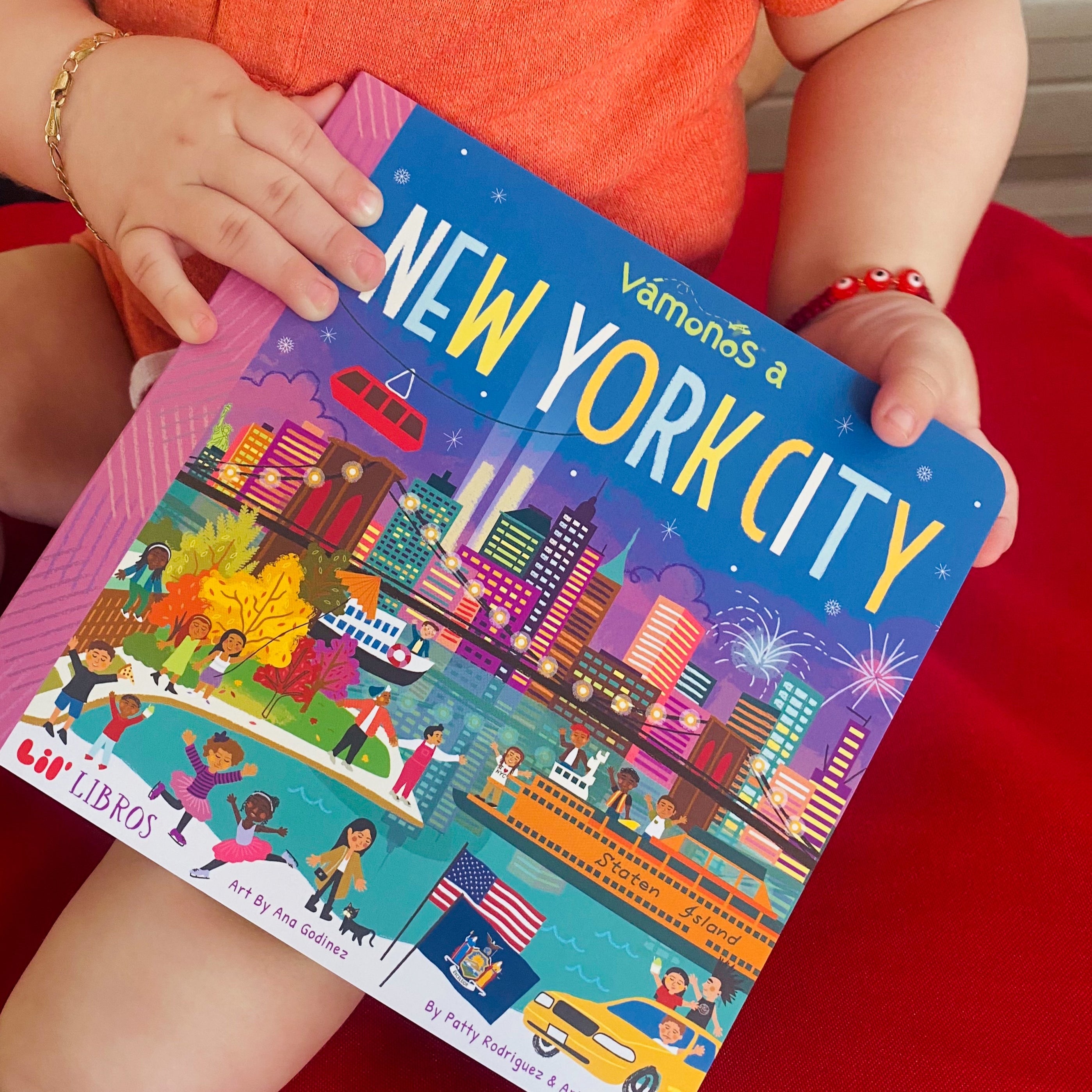 Image of VÁMONOS: New York City board book being held.