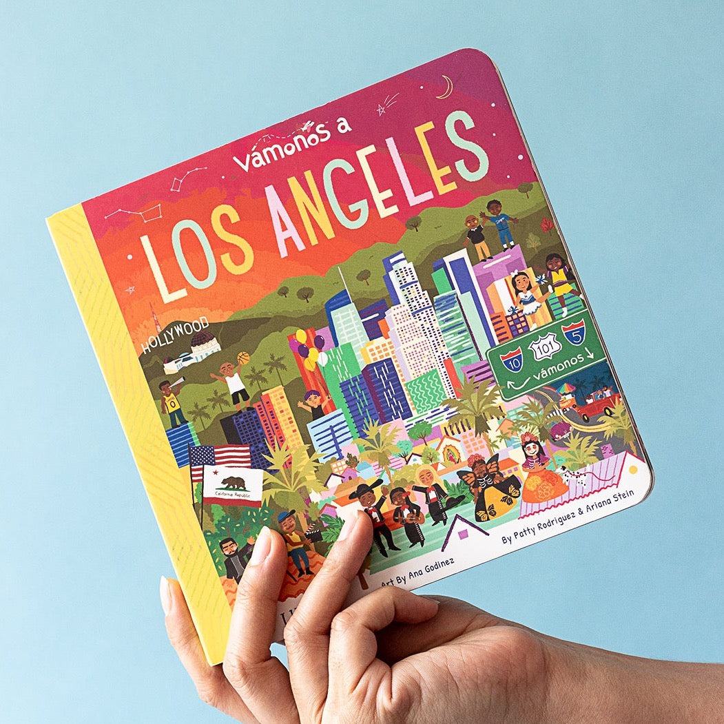 Image of VÁMONOS: Los Angeles board book being held.