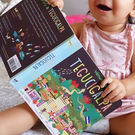 Image of VÁMONOS: Tegucigalpa board book being held.